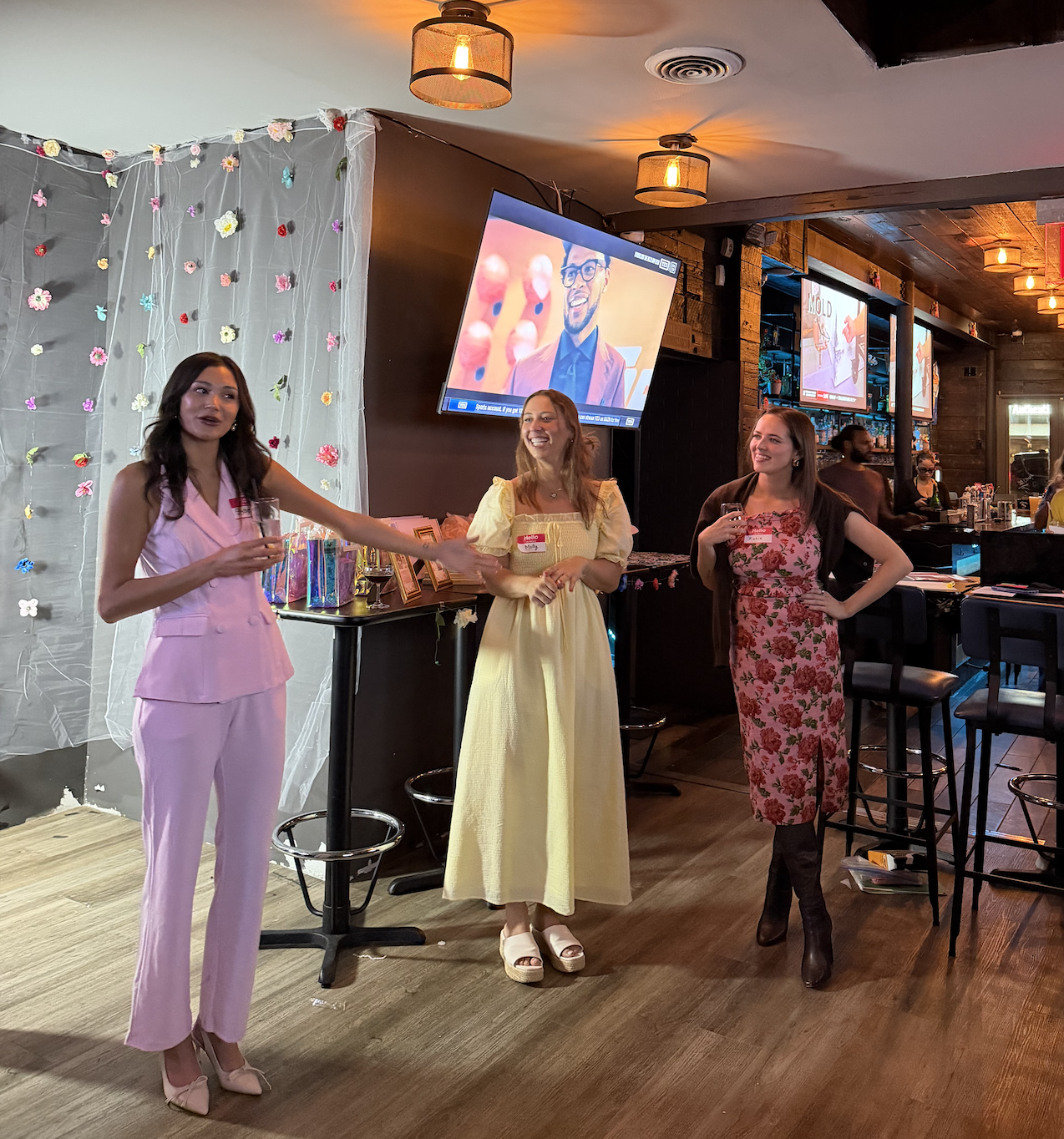 Sydney speaking at an event with three guests